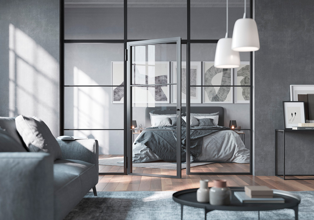 Lofttür aus Stahl und Glas von Hörmann zwischen Schlafzimmer und Wohnbereich.