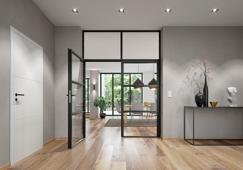Двері в стилі лофт від Hörmann між коридором і житловою зоною візуально поєднується з чорною фурнітурою «black.edition» для міжкімнатних дверей.